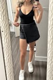 This skort is super cute and I received compliments when I wore it out. I am normally a 25 but ordered a 26 because I thought they would be too small without being stretchy but they are about an inch too big in the waist. They stretch out a bit after wearing them throughout the day. - Joanna F.