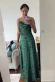 A long elegant dress that fits perfectly. The slit is pretty modest flows freely. - Courtney S.