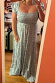 Fits really well, it's a little long on me and I'm 5'4 but I'm planning to wear heels. The material is great for bigger boobs since it's stretchy - Sara B.