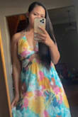 Here is my completely honest review, based on other reviews I decided to size up and that was the most right call! I'm always an xs in everything but purchased this dress in a medium and it fits like my other xs dresses I own. So I highly recommend sizing up or two, I could probably even do a large because the design of the dress is a little interesting. The front has a space gap and the dress can be tight around your rib cage too, it's very fitted on me. Also, this dress is perfect for anyone 5'4 and under. I'm 5'2 and with flats it's perfect, I wouldn't recommend it for anyone taller it prob would be a midi style which I'm confused on the model being 5'9 and having on 5-inch heels, I don't know how it isn't shorter on her. I wore it with my 5-inch heels and it was much shorter. The color is beautiful and the dress is gorgeous! But size up! Especially if you have hips and curves but either way size up! - Chole W.
