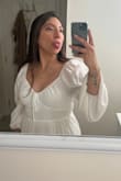 Ordering a M fit me great. Tying the strings to get that snug fit around the chest area was easy and really made the dress. The dress length was right above the knee and very flowy :) I recommend white undergarments/bra/undies. But other than that, comfy dress!!! - Vannesa L.