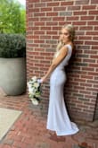 I tried on tons of dresses for my wedding and just was not finding "THE ONE!" I wanted a plain white dress that reminded me of Caroline Kennedy. This was stunning hands down. I have a tattoo on my backside and you could not see through it the quality is amazing and fits like a glove. I had to get it hemmed because I'm shorter but other than that minor adjustment PERFECTION! - Madison C.