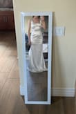 The top fits well, but tight around the tights. VERY stretch material, not much structure. Wanted it for my wedding, but just didn't fit my body type well and not as white as the picture shows! - Carinna D.