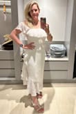 Love this dress and got SO many compliments wearing it to a white party down at the beach. I got 4 dresses to try, and this one was definitely my favorite, as well as my husband's.  Just makes you feel pretty and classy.  It's lined, but not heavy or hot, and breathes well.  I'm often a size M, but I needed a L (per the reviews, too). Fit perfectly though.  Any smaller and it wouldn't get zipped.  I'm fairly well proportioned, but do have a little more going on around my belly. - Lauren M.