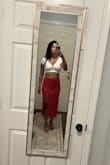 It is great but seems to be made for tall people. I'm 5'3" and it goes super high. Could even double as a dress it has a thick band at the top that you can fold so it's not as high. In my photo, it is folded over twice. It's not super noticeable so that's nice.  The dress photo is without any folding I find that the slit isn't as high as I would like with just the 2 folds. The material is stretchy, so I am tempted to size down so that the waist would be smaller (I got a Small). I am usually a size 4/6 in bottoms. Overall I love the color and style, it's a great staple piece to keep for many years. - Keily F.