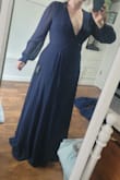 Very elegant and slimming definitely long I needed it hemed atleast an inch and a half with flats very nice quality and I'm looking forward to wearing it - Kata C.