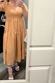 The filter on the model photos are quite deceiving. The actual dress is much, much brighter. It's still very pretty and worth keeping, just not the expected color. The dress is large and long on me (5'3), so I sized down, but still need to wear extra high heels. Overall, this is a beautiful spring dress. - Abbigal S.