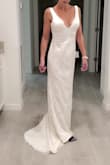 Beautiful dress but the bust was uncomfortable. Also, I eliminated it right away because there was a make-up stain from a previous buyer. - Angela D.