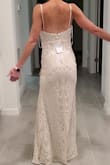 This is beautiful but didn't look good on me. It fit very snug and made me look like I had a gut. I'm very lean so maybe it hit me wrong because I am tall. It is a pretty dress. Just not on me. - Angela D.