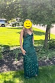 I wore this dress to my friends wedding and I received so many compliments. It fit so nicely, gave my body nice curves. I have a very small bust, but I wore tape on pasties and that worked fine. The back was so beautiful with the lace tie. I am 5'11" tall and I have to say, the length was long...so if you are not wearing heels, you will probably need it hemmed. The quality and the color are gorgeous. I would absolutely recommend this! - Adrianne S.