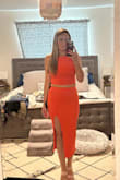 I love my one shoulder split midi dress, and thought this would be similar plus the orange is right on trend. I have a long torso, and I even found the pieces to be too close together. If I set the skirt at the smallest part of my waist, just above my belly button, then the top is too long and creates an unavoidable muffin top. I folded the top under to create more space and it looks better. Maybe it's just my body! - Jaime N.