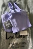 This set is super cute but I ordered the purple and the color is drastically different than pictured. I saw several reviews saying the same thing but Lulus replied saying the color issue had been fixed. I just revived this on May 7, 2023 and it is still a lilac color vs the fuchia color pictured. It's still a pretty color but just not what I expected. I needed to size down because I wanted a tight fit. Very flattering set otherwise! - Alyssa B.