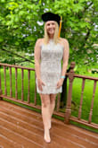 The dress fit really well overall. My hips are much larger than my waist so the waist was a little loose but not noticeable to others or in photos. I also wore a sticky bra to fill out the top. It was a little short, especially when sitting but worked great overall for my graduation. - Danielle W.