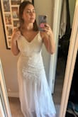 The dress was beautiful, the beading is very high quality and the tulle is beautiful. I have athletic shoulders and the medium was tight in my arms. Also, I thought where the tulle started was not the most flattering on me. I'm going to return it because it just wasn't that comfortable on me, I would probably need to get a Large to fit my shoulders but the dress wouldn't be tight enough. - Sophia C.