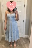The dress is longer than I expected but I still like it! I'm planning on wearing this for engagement pictures. I love how the top fits, and the straps are adjustable.
Update: I added a picture from my engagement pictures. It turned out perfect! - Paige S.