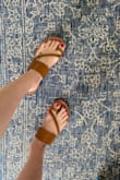 Love these sandals so much that when the toe peeled a little (from me tripping like a klutz) I immediately ordered another pair. They're super comfortable and a perfect luggage brown color. I wear them dressed up and with shorts dressed down. They don't rub anywhere or cause any pain. They can become slippery if they get wet or if you wear them to a pedicure so beware. - Amanda S.