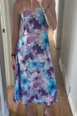 This dress is very flattering & comfortable. Fits as expected, and I love the length!! The material is light and breathable. Very excited to wear it to a summer wedding. - Madeline G.