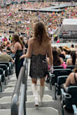 It was a great dress for the Taylor Swift Eras Tour (and probably will be reworn as a NYE dress in the future). I had a friend use a black hair tie to connect the back straps which turned out to be a great way to keep the dress in place as the straps were a little prone to slip off the shoulders without it. The sequins did not fall off at all and there is a lining inside the dress so it's comfy against your skin. - Rachel S.