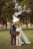 This dress was my dream dress and fit me like a glove. I did have the tailor add a handle to the train to be able to dance in and tack down the lining onto the slit so the inner lining wouldn't show. The slit is a little on the higher end but is manageable. Such an affordable wedding dress option! - Meredith R.