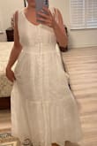 I purchased this dress for a beach photo shoot with my baby. It is so beautiful and well made. The embroidery was so beautiful too. I am petite- 5'3 tall. The size small fit perfect everywhere--it was just too long for me. The dress fit so great that I altered the bottom. The dress is very well lined and not see through. It is also comfortable. A great postpartum dress....I felt so good in it for my photo shoot. - Michelle S.