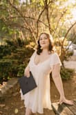 This dress worked out perfectly for graduation pictures! It's super flirty and flowy too! I was worried about sizing, but it fits perfectly for me. The only thing I will point out is that if you have a bigger bust to be aware that the dress is very busty and shows a bit of cleavage. I didn't mind it too much, but for graduation photos, I wanted a few more professional-looking pictures, so my photographer helped with that aspect. I also used fashion tape and a stick-on bra to keep everything in place, and it worked out fine! Overall I'm very pleased! - Aiden B.