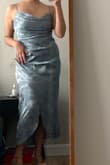 I love this dress! Super comfy and flattering, received many compliments in it. It needed very minimal ironing which is always nice. I'm 5'4 and it was a bit long on me but since I wore it with platforms it was alright. I had to secure the drapey front part with a safety pin but I think a larger-chested person wouldn't have that issue. I can't wait for another occasion to wear it! - Natalia R.