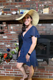 The dress fit true to size and was not too long. It said very well, right above the knee. It was a very flattering dress to the legs and to the bust. It was very flowy in the material was nice and soft would definitely recommend this dress. - Jessica