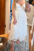 This dress is nearly perfect if you have a petite frame. Usually, Lulus XS size is still slightly too big or massively too long, but this dress is only a little longer on me than on the model. The bust is tighter than I would have expected, but I would not size up if you are typically an XXS in Lulus dresses. - Katie A.