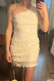 I originally bought this to wear for my bachelorette party. I purchased the size medium because I'm usually between small and medium. The medium was too loose around my chest and waist area and just seemed like it hung on me because the sequins weight it down. I exchanged it for the small but the small was then too tight under my armpit and way too short. The photo attached is the size small. 

Would be great for shorter women and women who aren't as broad across the shoulders. - Megan M.