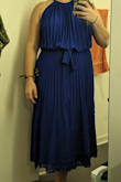 The dress on the model is kind of misleading. The part right above the tie that's supposed to be a tiny bit billowy, is VERY billowy. It made my top half look much larger that it really is. It's sewn like that too so you can't just pull the dress down at the waste to fix it. Super bummed. - Ashley L.