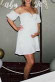 Got this for my baby shower dress. It was perfect!

The only issues I had were:
1) Tried ordering this in small, red back in February for a vacation and the top was tight and made me have the weird armpit boobs
2) Got the white in medium; no more armpit boobs but I did find that it slipped down quite a bit. Never felt like I was about to be exposed, but I did feel a little too boob-alicious. I was pulling it up quite a bit.
3) After an entire day wearing this, the elastic on the arms was starting to bother me. It's a perfect tightness to stay in place, but it wears on you after a while.

Overall, I love the dress and feel like the length is still perfect for my belly to grow and not end up being super short. Definitely will be cute post-pregnancy too. Since I'm due end of July, I think it'll be a great loose fit postpartum. - Michelle M.