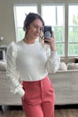 The shoulder puff gives it the perfect amount of pizzazz to make a statement outfit. Great with high waisted pants. - Amber R.
