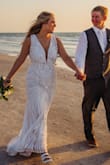 I never leave reviews, but I could not be more impressed with this dress! A medium was a little too tight in the hips, so I bought a large and had minor alterations done by a family member. It was comfortable, light, and just the right price for a dress you'll only wear one night of your life. - Brianna T.