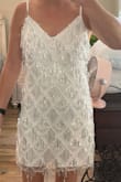 I bought this dress for a night out in Vegas for my bachelorette party and I love the fit! I ordered a medium because I did not want it too snug. It fits well and still allows for room to flow. I love that it has some sparkle but is not overwhelming with sequin or bling. - Sharla P.