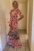I got sooooo many compliments on this dress. It was comfortable to wear and fit like a dream. The colors are bright so it was perfect for a spring/summer wedding. I wore red shoes to compliment the red lining. I will wear this to several events this summer. - Tammy F.