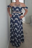 I'm really happy with this outfit and can't wait to bring it on our upcoming cruise. The material is light and very comfortable. The skirt is a little long but works well with a platform or wedge sandals. It's very flattering. The skirt also has a bit of elastic in the back and a zipper on the side so you can choose how much midriff you want to show and it stays in place. The quality is nice and I like that I can also pair it with a white tank top for another outfit option. - Marissa B.