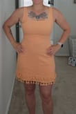 This dress is very flattering and fits great on my body type. Like the other reviews said it runs small so I ordered a size larger. It's still a little snug so I'm hoping it doesn't shrink in the wash. The dress is lined and the quality is great. The tassels are so fun and I'm excited to wear this on vacation! - Marissa B.