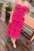 The dress was so fun and flowy and fit great! This dress is definitely best for those with a smaller chest. For reference, I am a 34 B and I don't know if any bigger could've fit at least in the medium. Definitely a crowd favorite! - Courtney H.
