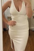 I ordered this dress for my college graduation. This dress was the perfect midi length and went right to my knees even though I'm super short. It was super supportive of my chest (didn't need a bra) and the material was good quality and not see through at all. I ordered an XS which is what I normally am in dresses.. I have a petite frame but there was room for stretch.  The shipping was super fast. I paid for 3-5 day shipping and ordered it on a Friday afternoon and it came by Sunday. 10/10 recommend!!! - Victoria H.