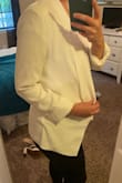 I ordered a large because I prefer a baggier look with blazers but this one runs small. I'm normally a medium but the large fits a little tighter around the shoulders and back than most mediums would. Still very cute and works with the outfit. If you purchase just size up. - Liz H.