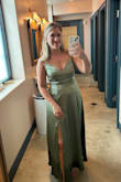 I love the color and details of this dress. I received several compliments! Unfortunately the dress wrinkles quite easily and shows/holds onto any water that touches the dress (so, not ideal for a rainy wedding day!) Some have commented on the bow thankfully my bff who tied it for me is a surgeon so that bad boy stayed put all night. With a good tight tie, you'll be good to go. - Sydney P.