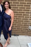 This dress is Amazing!! I'm a new mom and learning how to fit/dress my new curvy body. I'm wearing a size medium. My measurements are 40in hips, 31in waist, and 34D bust. I got so many compliments on this dress when I wore it to a wedding. Perfect cocktail attire! I love the front as it hid my mom pooch so well! The strap is adjustable which was great since my hips are bigger than bust and needed to adjust. It's satin material so took a while to steam and iron but I'm overly weird about wrinkles, hate them so much. But worth taking the time. I wore a strapless one-piece Spanx to smooth everything out and to lay better on my body. I love the navy blue color. I wore with gold jewelry but would look good with pearls and silver jewelry as well. I read just about every review on this dress before buying which was helpful and reassuring. If you're on the fence about purchasing, you won't regret it!!! - Angela M.