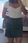 Lighter green than pictured. Fits me great but would not recommend it if you have a dump truck as it's a bit of a squeeze to get over my modestly-sized bum. Really cute and comfy. - Ro M.