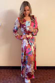Beautiful dress, colors were amazing! I am pear shaped, small at the top and larger on bottom with athletic legs, I could have probably sized down but this size was very comfortable and lightweight. The slit was perfect! Wore to a spring wedding on a rainy day and it kept me warm but didn't get too hot dancing! - Tayler N.