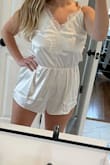 Super cute! Im typically a size large in dresses, but I order a size up in all rompers to avoid them riding up and the XL was perfect for me! I will say that its less of a true white and more of an ivory but not an issue for me. Planning to wear it with a robe or kimono on my wedding day while I get ready with my bridesmaids. - Sara N.