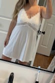 I'm usually a large in most dresses and the large fit me perfectly. Beware that there is ZERO support in the bust. Not a problem if you're cool with that! Super soft too. - Sara N.