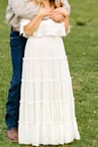 Got this for engagement pics and it made me feel like a million bucks! I'm usually a large in dresses and the large fit me best for this one too. My only complaint is that it's a tad see-through and could use a slip. I wore nude undies and you could see them if you looked hard enough. Also, If the ruffle on the bust were to fly up, you would absolutely see your chest or bra. Despite that, I love it! - Sara N.