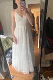Ok I bought this dress as something to JUSXST have "on deck" for the events taking place the week before my July wedding and, y'all... I love it so much that I'm going to wear it at the Reception as my "dance dress." Breezy, flattering, comfy, whimsical, romantic, beautiful quality. You'll feel like an angel in this dress! Like others have said, the bow could use some steaming but otherwise this pretty girl is ready to wear right out of the package! LOVE IT! - Anna S.