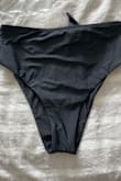 Did not like that the bottoms appear to be a moderate coverage bottom from the front but they are very cheeky in the back. Very bummed these didn't fit because I loved the front! As you can see from the photo, the back cut is more narrow than the front. - Alissa C.