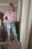 The top is super cute, flattering, feminine, easy to wear, and made of great quality. Love the color, sleeves, and tie in the back. It has a side zipper which makes it easier to put on and take off. It's a special piece. **Note** Pix will show me wearing it but I ordered it for my 21 yr old daughter for a bachelorette event. - AMBER K.